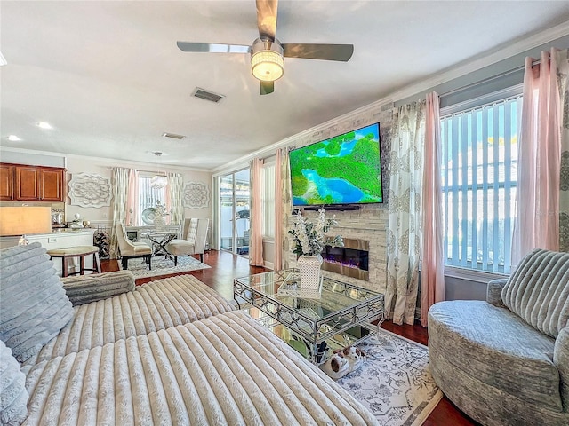 16819 Stanza Ct, Tampa, FL 33624 - living area featuring wood finished floors, visible vents, crown molding, and ceiling fan