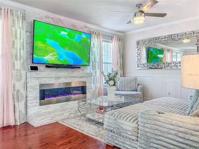 16819 Stanza Ct, Tampa, FL 33624 - living area featuring ceiling fan, a stone fireplace, crown molding, and wood finished floors