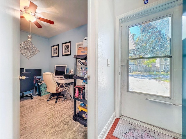 16819 Stanza Ct, Tampa, FL 33624 - doorway to outside featuring baseboards, wood finished floors, and ceiling fan