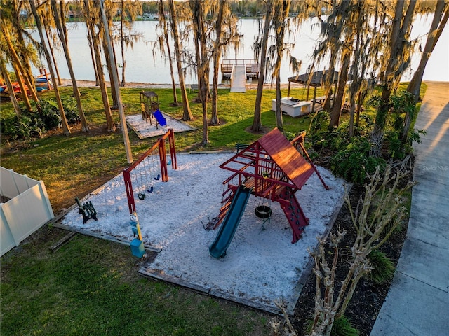 16819 Stanza Ct, Tampa, FL 33624 - view of community featuring a lawn and a playground