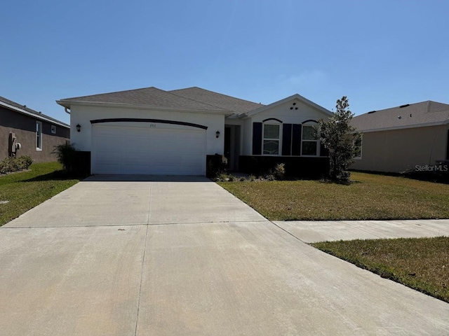 7937 Wheat Stone Dr, Zephyrhills, FL 33540 - ranch-style house with concrete driveway, an attached garage, a front yard, and stucco siding