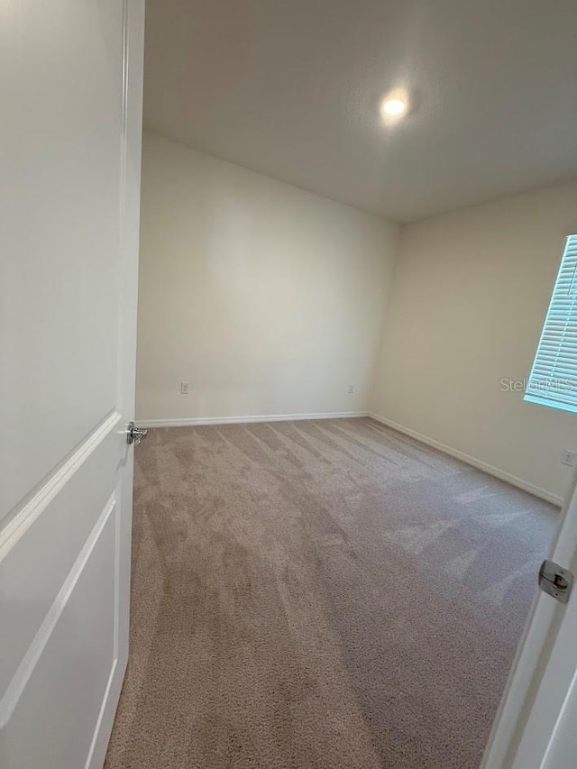7937 Wheat Stone Dr, Zephyrhills, FL 33540 - carpeted empty room with baseboards
