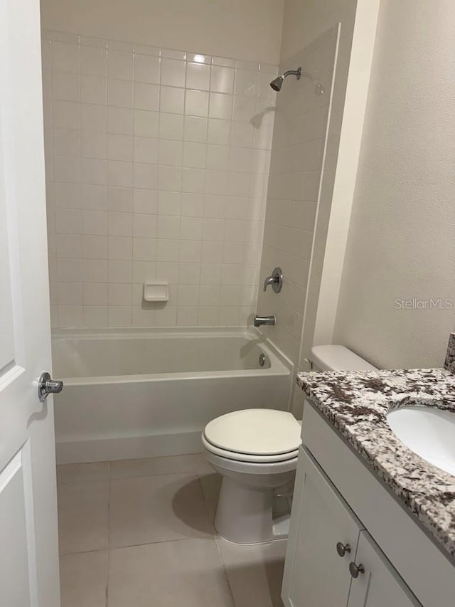 7937 Wheat Stone Dr, Zephyrhills, FL 33540 - full bathroom featuring tile patterned floors, vanity, toilet, and shower / bath combination