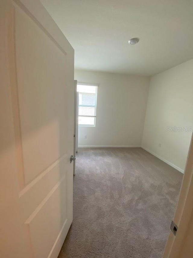 7937 Wheat Stone Dr, Zephyrhills, FL 33540 - carpeted empty room with baseboards