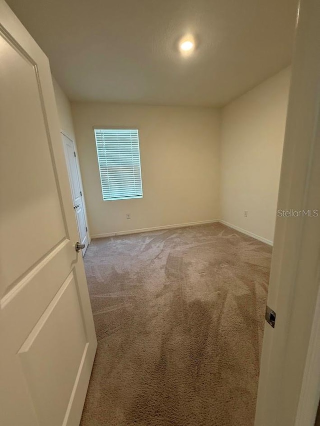 7937 Wheat Stone Dr, Zephyrhills, FL 33540 - carpeted spare room with baseboards and recessed lighting