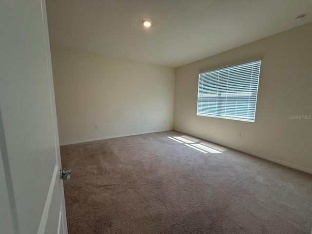 7937 Wheat Stone Dr, Zephyrhills, FL 33540 - carpeted empty room featuring baseboards and recessed lighting
