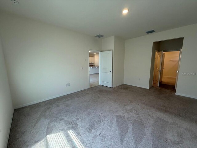 7937 Wheat Stone Dr, Zephyrhills, FL 33540 - unfurnished bedroom with carpet and baseboards
