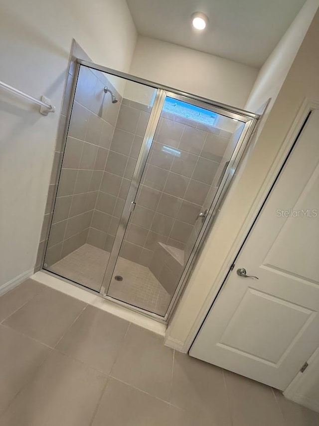 7937 Wheat Stone Dr, Zephyrhills, FL 33540 - bathroom with a stall shower and tile patterned floors