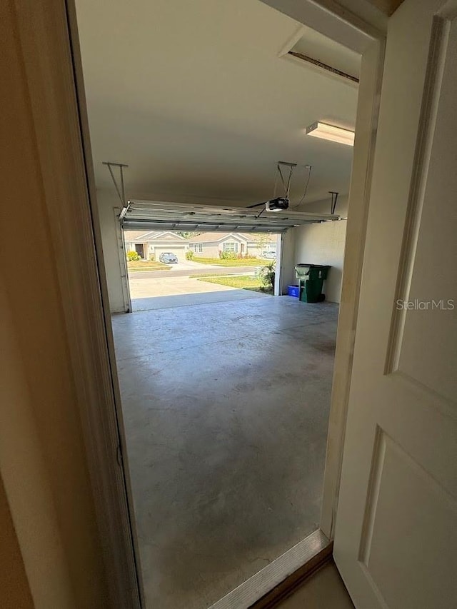 7937 Wheat Stone Dr, Zephyrhills, FL 33540 - garage featuring a garage door opener