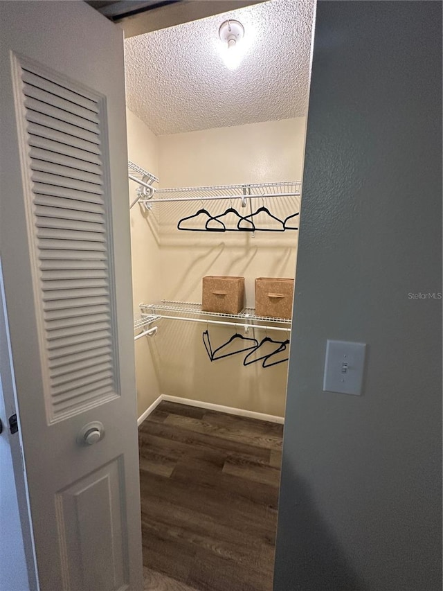 7601 Como Dr, New Port Richey, FL 34655 - spacious closet featuring wood finished floors