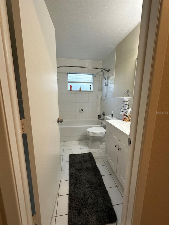 7601 Como Dr, New Port Richey, FL 34655 - full bathroom with tile patterned floors, washtub / shower combination, vanity, and toilet