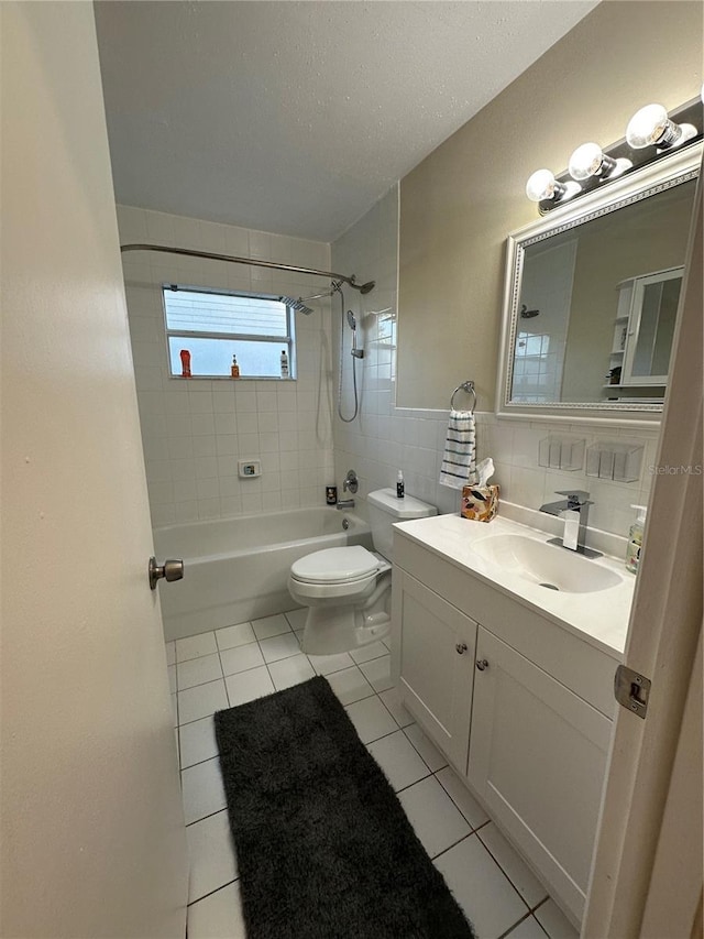 7601 Como Dr, New Port Richey, FL 34655 - full bathroom with tile patterned flooring, shower / bathtub combination, toilet, vanity, and tile walls