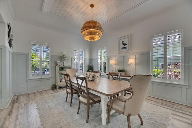 dining room featuring a decorative wall and wood finished floors