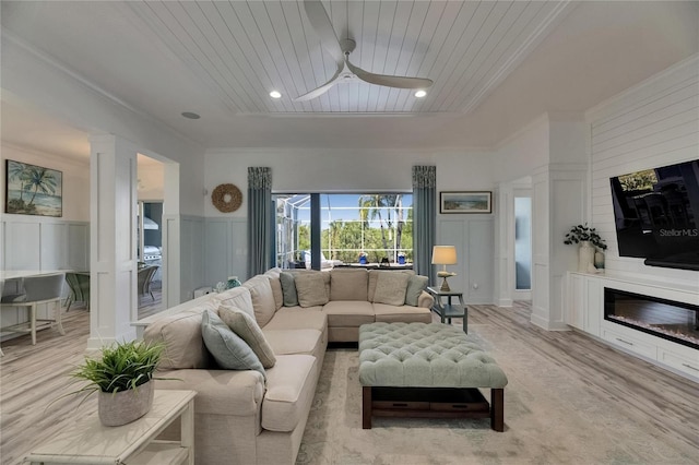 living room with light wood-type flooring, a decorative wall, wood ceiling, and ceiling fan