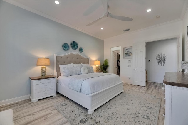 bedroom with recessed lighting, light wood-style floors, and ornamental molding