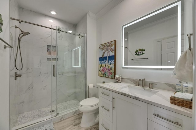 full bathroom with wood finished floors, toilet, vanity, and a marble finish shower