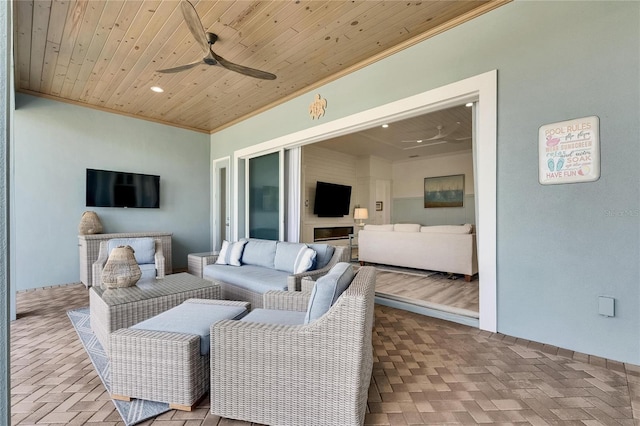 exterior space featuring an outdoor hangout area and a ceiling fan