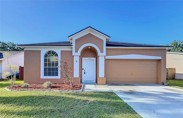 11535 Wellman Dr, Riverview, FL 33578 - ranch-style home with stucco siding, a front lawn, driveway, and a garage