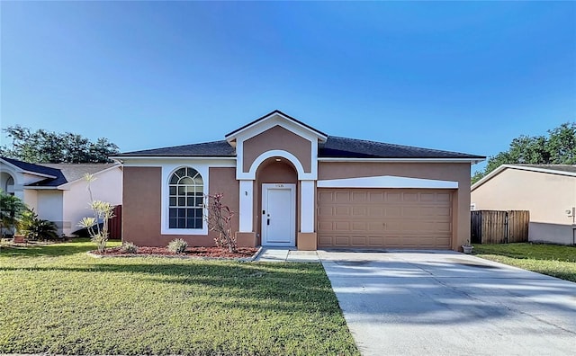11535 Wellman Dr, Riverview, FL 33578 - single story home with a garage, concrete driveway, fence, a front yard, and stucco siding