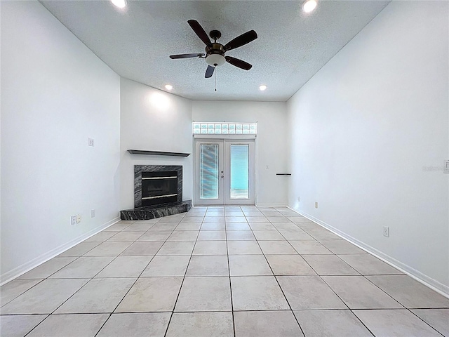 11535 Wellman Dr, Riverview, FL 33578 - unfurnished living room featuring light tile patterned floors, a ceiling fan, a high end fireplace, and recessed lighting