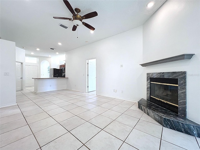 11535 Wellman Dr, Riverview, FL 33578 - unfurnished living room with recessed lighting, a high end fireplace, visible vents, a ceiling fan, and light tile patterned floors