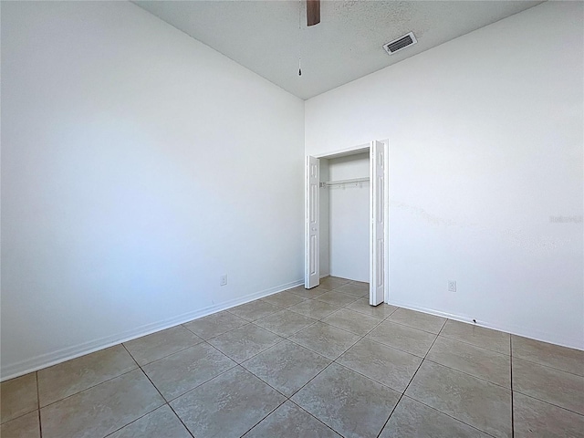 11535 Wellman Dr, Riverview, FL 33578 - unfurnished bedroom featuring tile patterned flooring, visible vents, a closet, baseboards, and ceiling fan