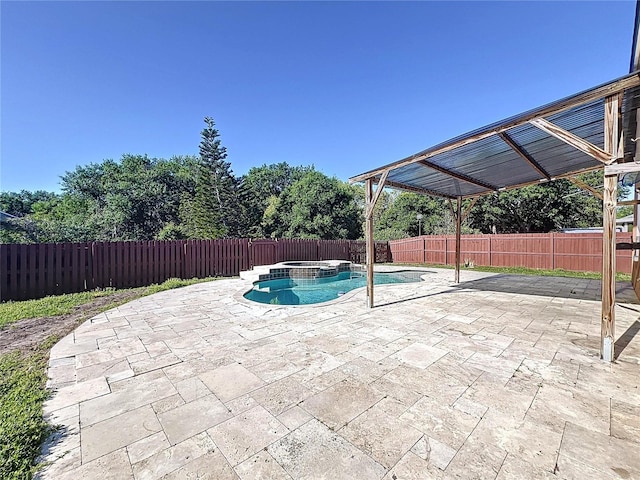 11535 Wellman Dr, Riverview, FL 33578 - view of pool with a patio area, a fenced backyard, and a pool with connected hot tub