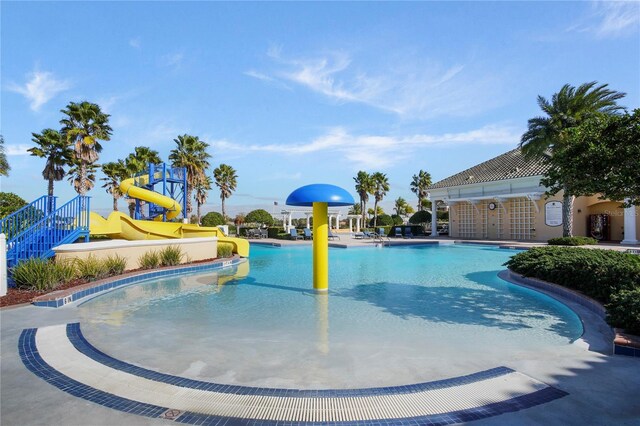 5026 Barnet Dr, Davenport, FL 33837 - pool featuring a water play area and a water slide