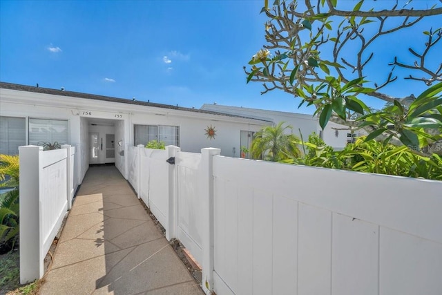 view of side of property with fence