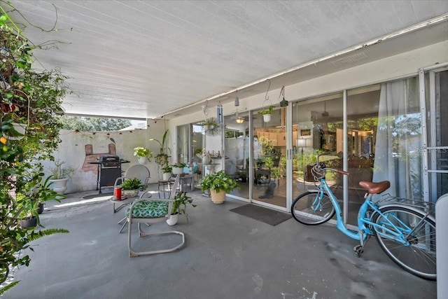 view of patio featuring a grill