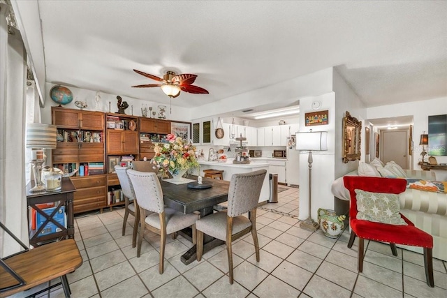 dining room featuring ceiling fan and light tile patterned floors