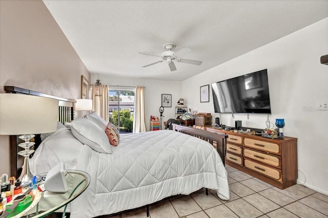 bedroom with ceiling fan and light tile patterned flooring