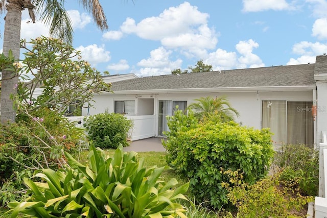 1655 S Highland Ave Unit C155, Largo, FL 33756 - property entrance featuring stucco siding and roof with shingles