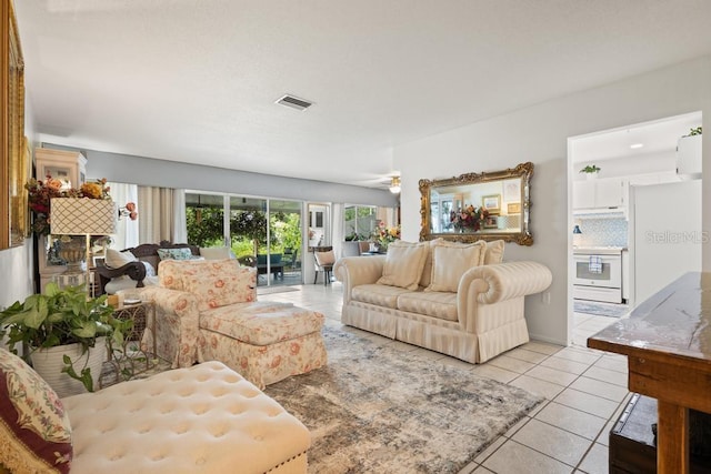 1655 S Highland Ave Unit C155, Largo, FL 33756 - living room with light tile patterned floors and ceiling fan