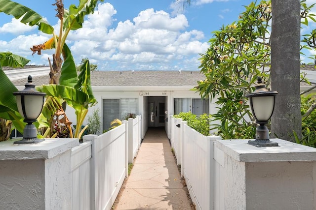 1655 S Highland Ave Unit C155, Largo, FL 33756 - view of front of home featuring fence and a shingled roof