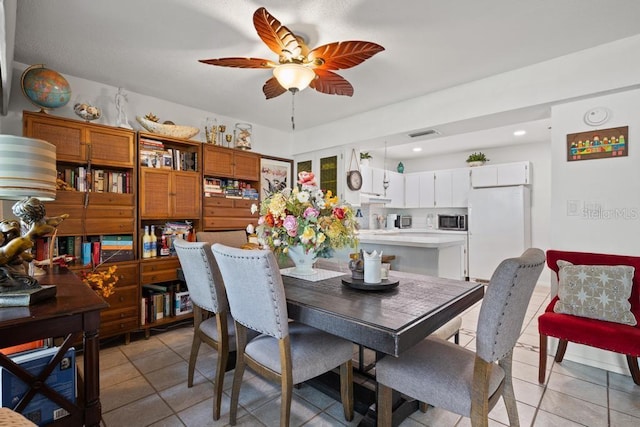 1655 S Highland Ave Unit C155, Largo, FL 33756 - dining area with a ceiling fan and light tile patterned floors