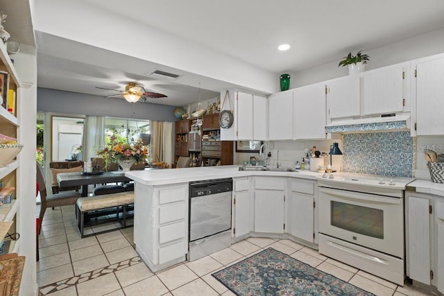 1655 S Highland Ave Unit C155, Largo, FL 33756 - kitchen featuring white electric range oven, under cabinet range hood, a sink, stainless steel dishwasher, and a peninsula