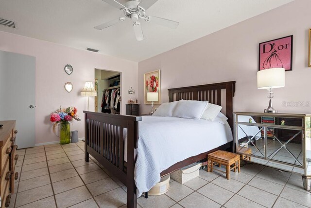 1655 S Highland Ave Unit C155, Largo, FL 33756 - bedroom featuring light tile patterned flooring, ceiling fan, a closet, and a walk in closet