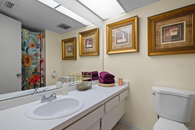 1655 S Highland Ave Unit C155, Largo, FL 33756 - full bath with toilet, vanity, tile patterned flooring, and a shower with shower curtain