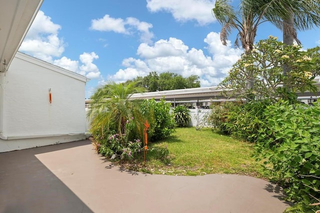 1655 S Highland Ave Unit C155, Largo, FL 33756 - view of grassy yard with a patio area
