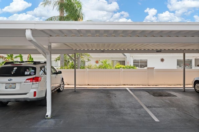 1655 S Highland Ave Unit C155, Largo, FL 33756 - covered parking lot with fence