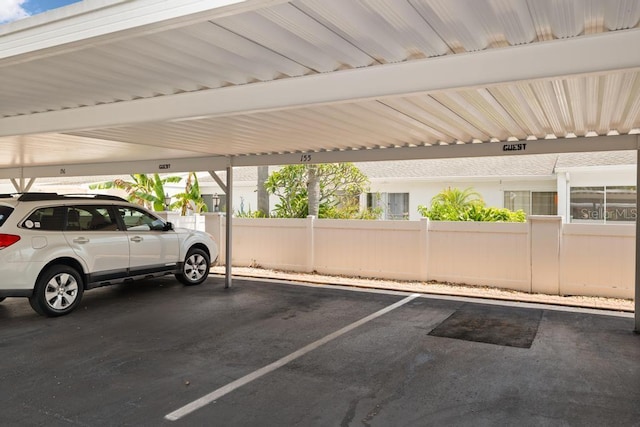 1655 S Highland Ave Unit C155, Largo, FL 33756 - covered parking lot with fence