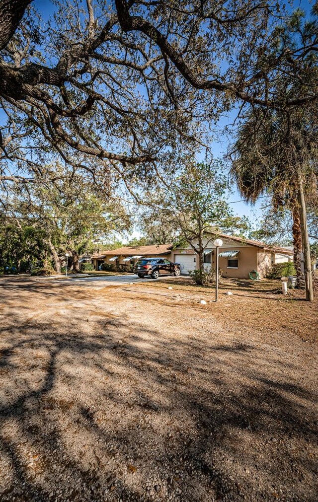 618 July Dr, Tarpon Springs, FL 34689 - view of front of property featuring stucco siding