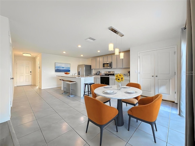 dining space with baseboards, visible vents, recessed lighting, and light tile patterned floors
