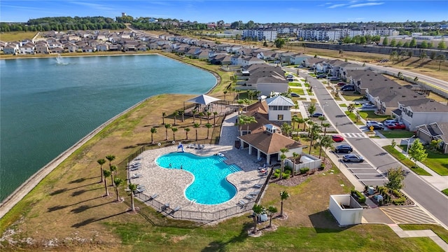 bird's eye view with a residential view and a water view