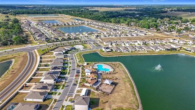 birds eye view of property featuring a water view and a residential view