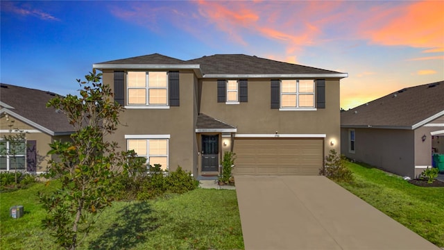 7782 Sail Clover Ln, Zephyrhills, FL 33540 - view of front of home with stucco siding, driveway, a garage, and a front lawn