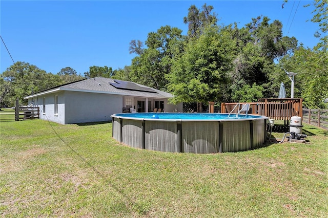 view of swimming pool with a yard, a fenced in pool, and fence