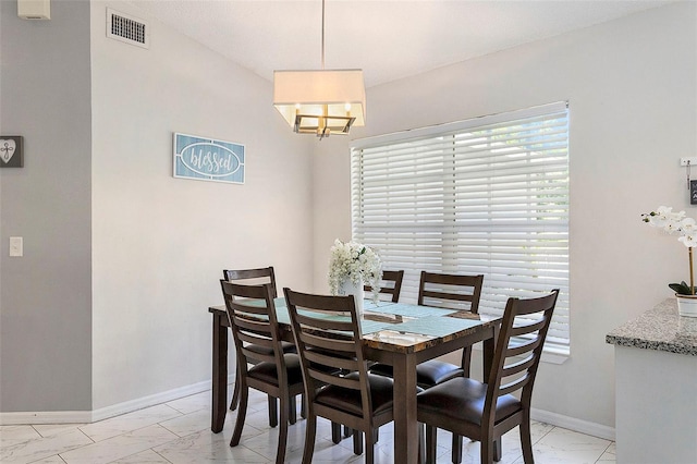 dining area with visible vents, baseboards, marble finish floor, and an inviting chandelier