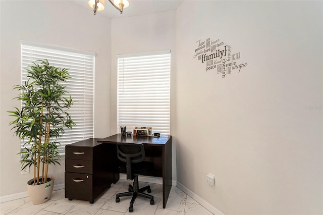 office with baseboards, marble finish floor, and a notable chandelier